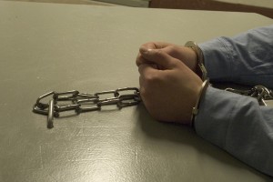 Inmate serving segregation time is handcuffed to the table at Oak Park Heights.